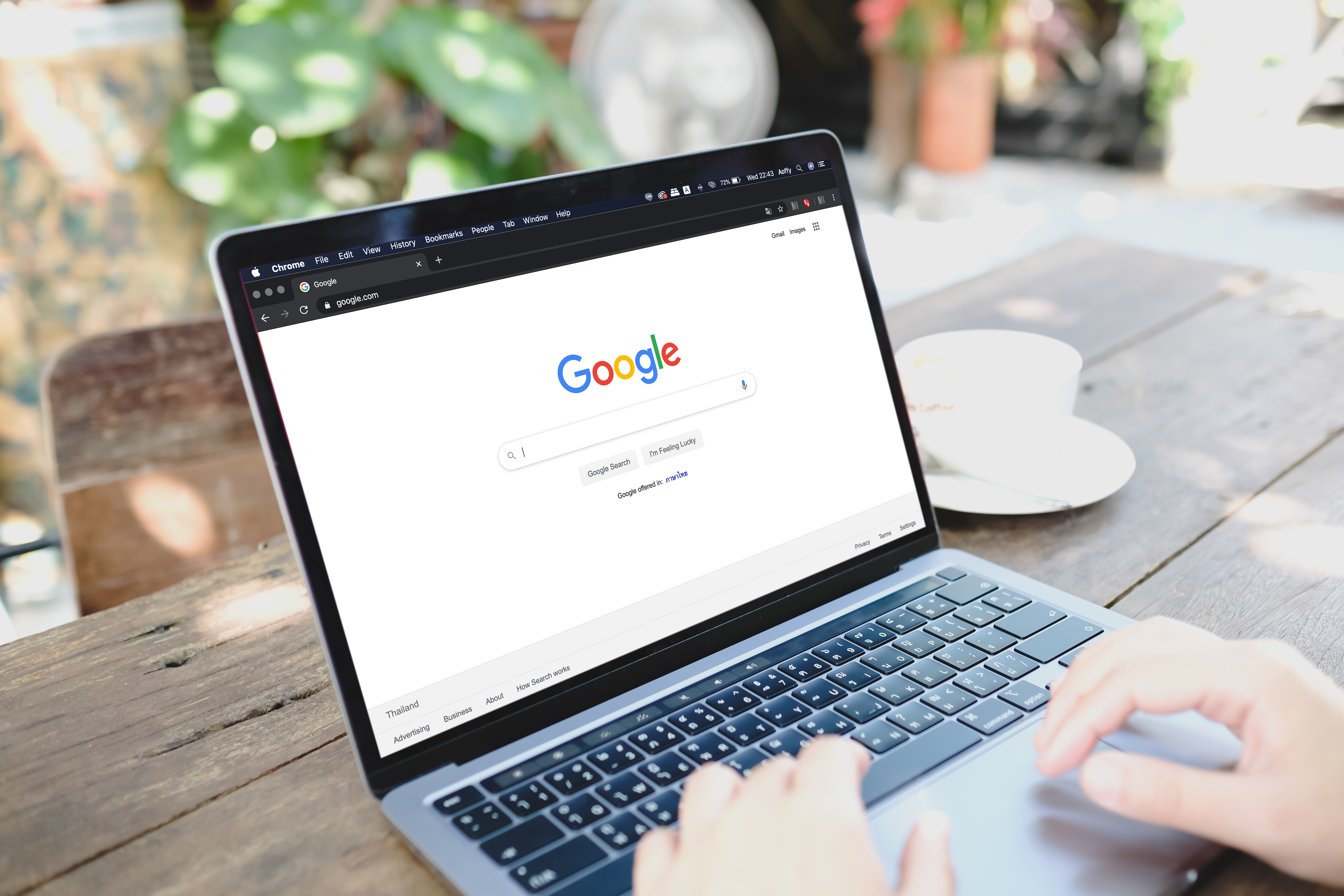 Someone searching Google on a laptop, the kind of result an SEO program is built to earn.